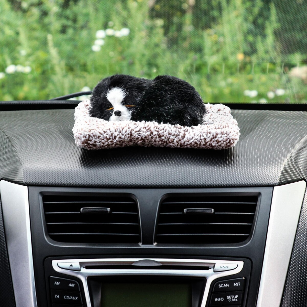 фото Игрушка на панель авто, собака на подушке, черный окрас no brand